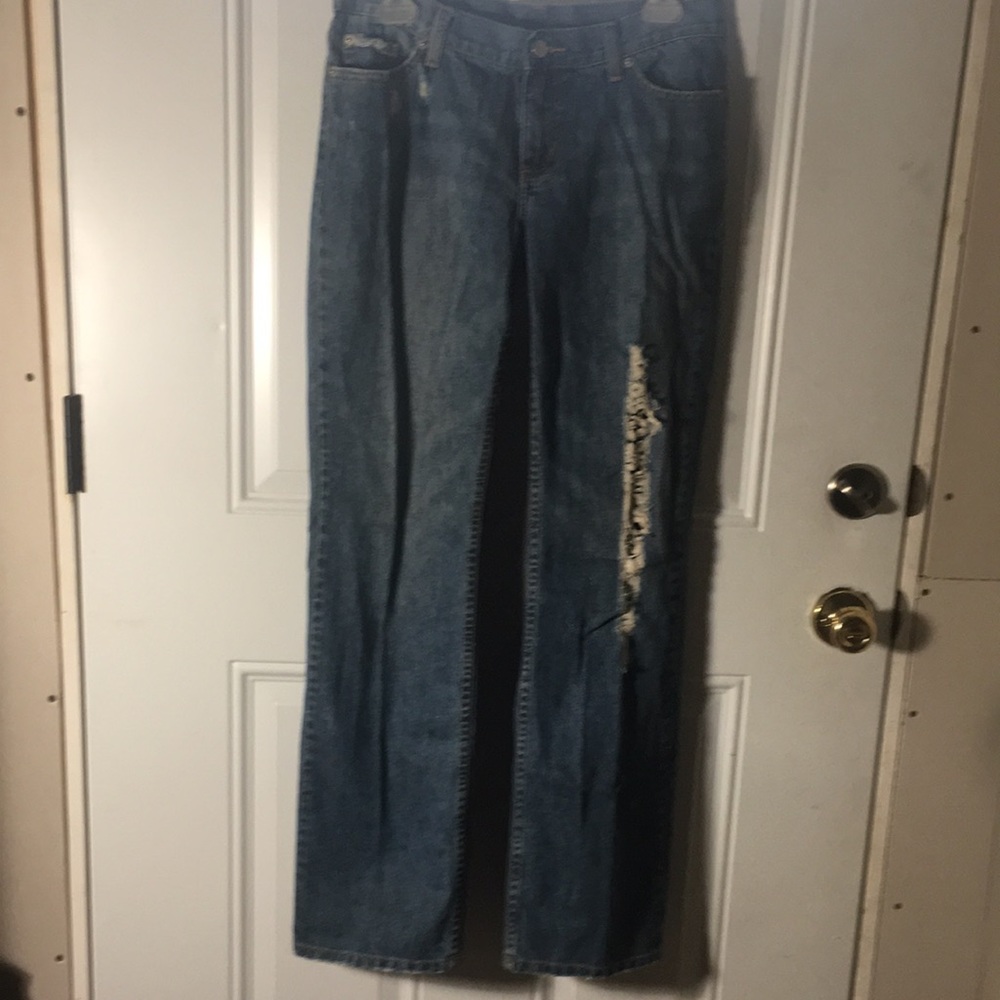 Distressed flared zip and button front non-branded jeans size 6.